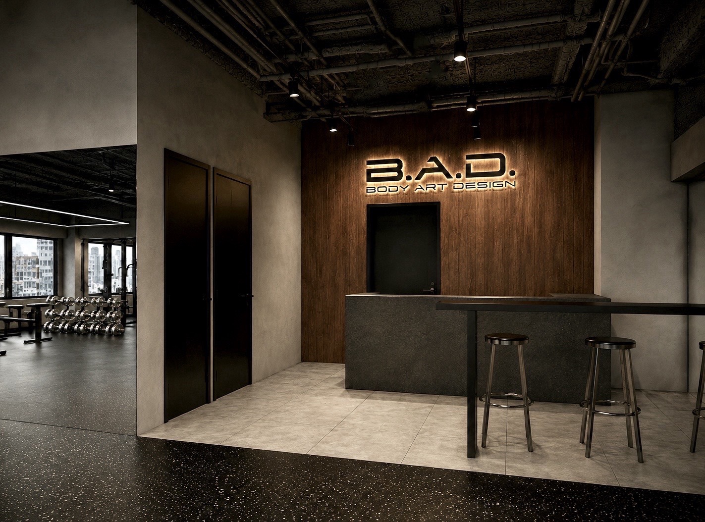 間接照明で浮かび上がる B.A.D. のサインと受付カウンターの完成イメージ